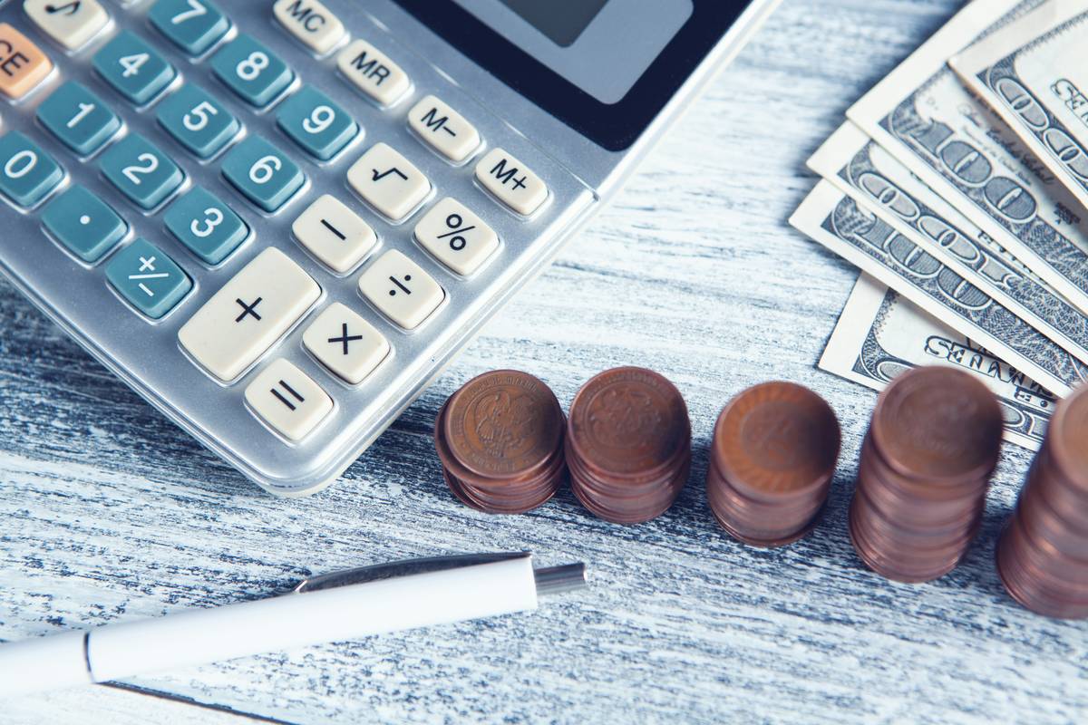 Freelancer offering remote bookkeeping services from home office with dual monitors and secure cloud software